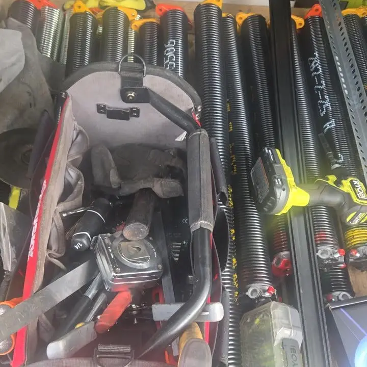 Torsion springs and extension springs, still in their packaging, staged on the truck
