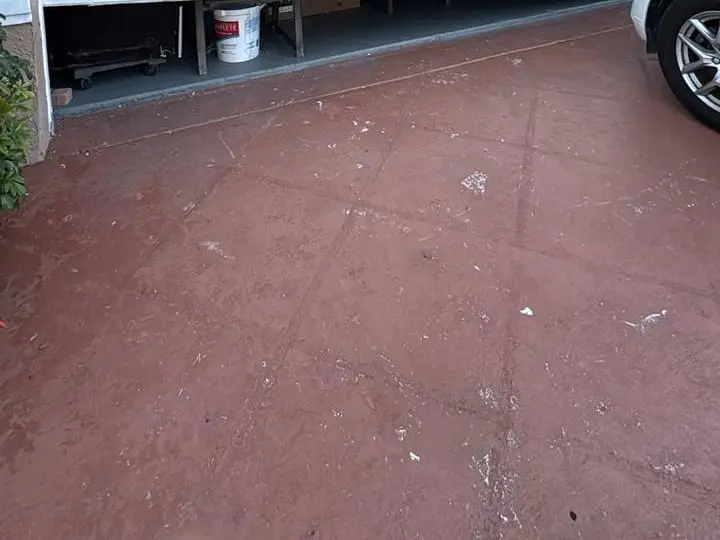 Inside a residential garage with the door raised